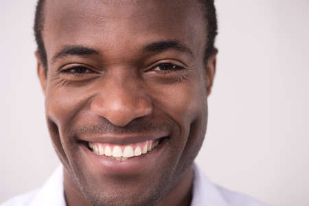 Happy African descent men. Portrait of cheerful African descent men smiling at cameraの写真素材