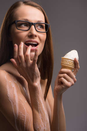Woman with ice-cream. の写真素材
