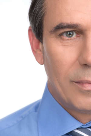 Confident businessman. Cropped image of handsome mature businessman looking at camera while isolated on whiteの写真素材