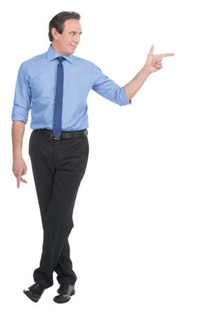 Assertive businessman. Full length of confident businessman pointing someone with finger while isolated on whiteの写真素材