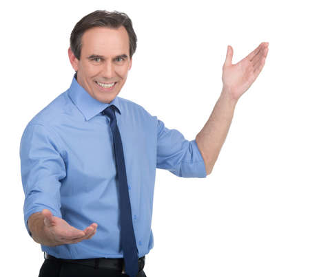 Businessman gesturing. Cheerful mature businessman gesturing while standing isolated on whiteの写真素材