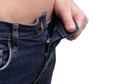 Men's jeans. Close-up of men undressing jeans while isolated on white