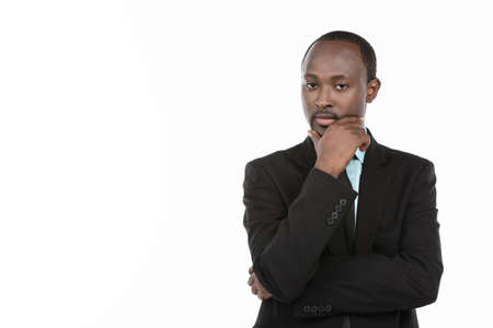 African businessman in suit thinking  White backgroundの写真素材