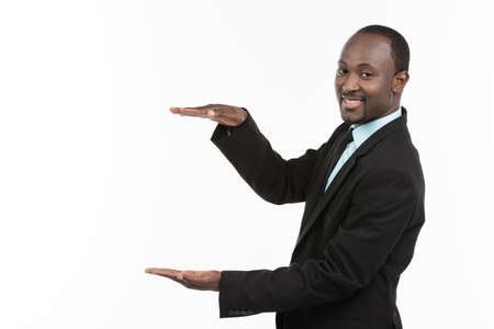 African Businessman presenting on white backgroundの写真素材