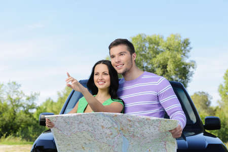 Beautiful young couple looking looking for the right derectionの写真素材