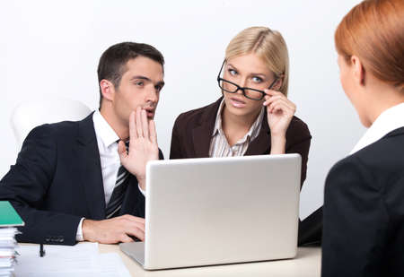 Are you sure she is right candidate? Two attractive young business people interviewing a job candidateの写真素材