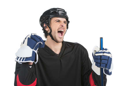Close up of screaming hockey player. Isolate on whiteの写真素材