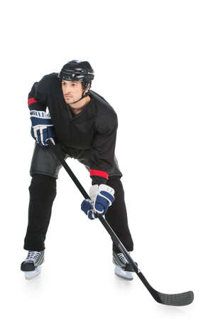 Hockey player is ready to fight of the strike. Standing full length isolated on whiteの写真素材