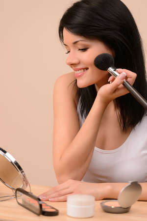 Morning Make-up. Beautiful young woman doing make-upの写真素材