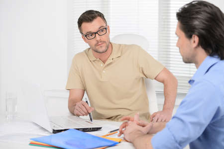 He has another vision of the problem. Two confident business people dicussing business problemsの写真素材