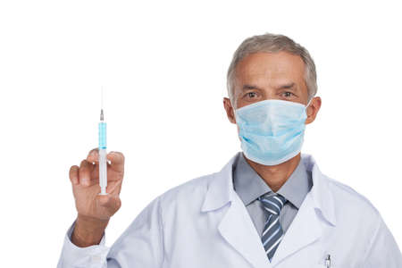 Experienced doctor is doing vaccination. Close up isolated on whiteの写真素材