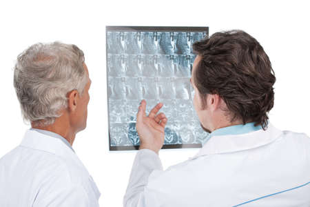 Close up of two doctors discussing diagnose of the patient. Back view, isolated on white backgroundの写真素材