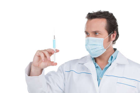 Adult doctor doing vaccination. Close up isolated on whiteの写真素材