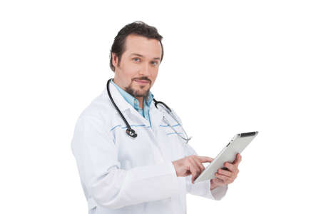 Portrait of Confident doctor with clipboard. Standing over white backgroundの写真素材