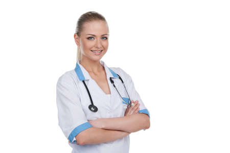 Portrait of young beautiful female doctor. Smiling isolated on white backgroundの写真素材