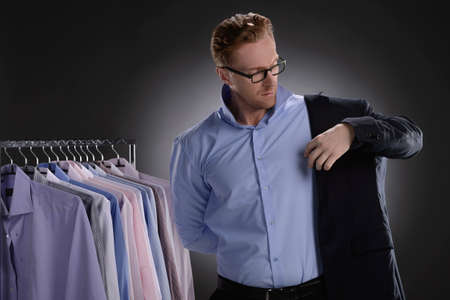 Men in retail store. Confident young businessmen wearing suit in retail storeの写真素材