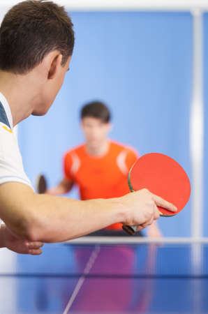 Table tennis game. Two young people playing table tennisの写真素材
