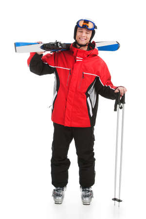 Handsome active man with sky in ski suit. Standing full length isolated over white backgroundの写真素材