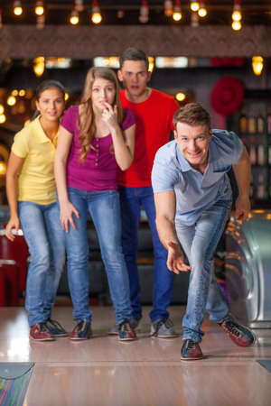 Bowling with friends. Friends having fun in bowlingの写真素材