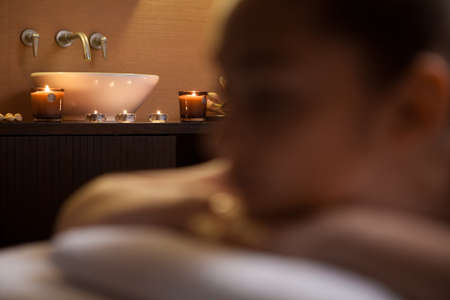 girl laying on massage table  girl is given massage of her backの写真素材
