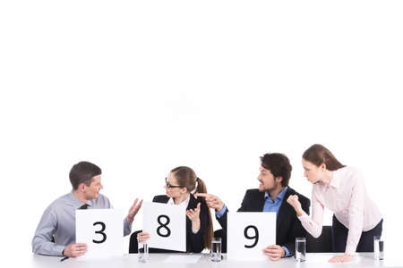 heated teamwork and discussion in group of four. three people arguing against one man 