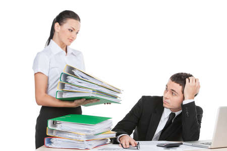 beautiful young lady holding documents. stressed businessman looking at documents with fearの写真素材