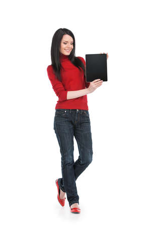 Portrait of smiling young female with tablet. Beautiful girl with long dark hair holding tabletの写真素材