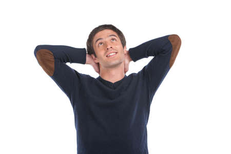 Happy casual young man looking up. handsome guy smiling isolated on white background の写真素材