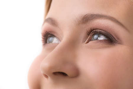 beautiful young girl looking and smiling. attractive blond woman laughing and watchingの写真素材