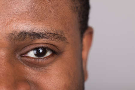 handsome man looking straight into camera. man having pretty and open eyesの写真素材