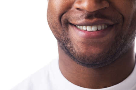 half-face of man sincerely smiling. handsome guy wearing white t-shirt