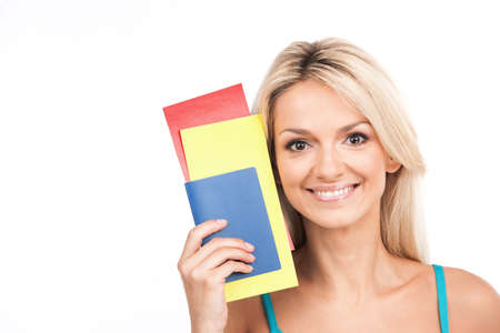 beautiful girl closeup portrait and smiling. young girl holding tickets on white background