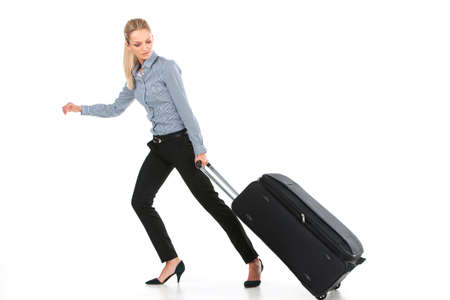 beautiful girl running with big luggage. side view of young girl on white backgroundの写真素材