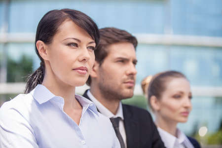 young business partners standing outside. Members of successful business team in close-up. の写真素材