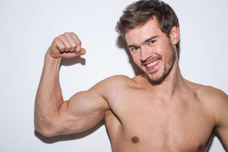 shoulder and arm male body. Fit male model showing his biceps. の写真素材