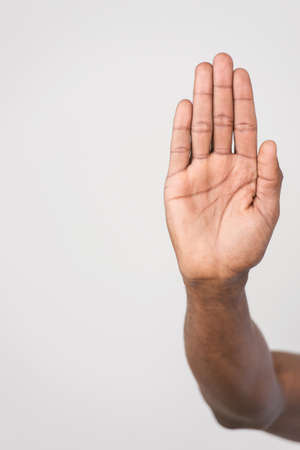 Male palm hand gesture, isolated on white background. man's hand make stop symbol isolated on whiteの写真素材