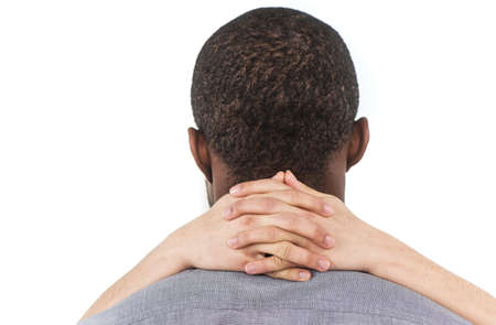 Beautiful young woman hugging boyfriend. african man standing with woman hands on his neckの写真素材