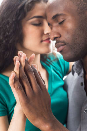 Closeup of happy young woman with boyfriend spending time together. Closeup portrait of african...