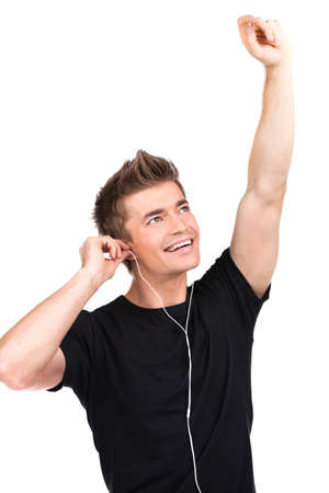 smiley guy in earphones listening music on white background.の写真素材