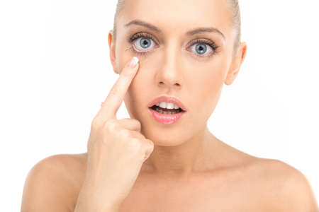 beautiful clean face of young woman without any wrinkles. Caucasian beauty model isolated on white backgroundの写真素材