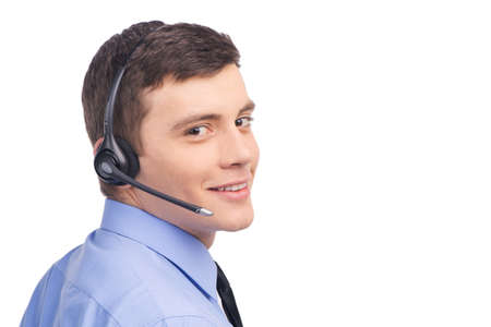 handsome technical support operator working on white. 