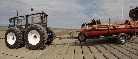 Lifeboat recovery vehicle towing a lifeboatの写真素材
