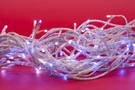 Christmas  fairy lights on red background