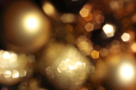 Abstract background with gold blured lightsの写真素材