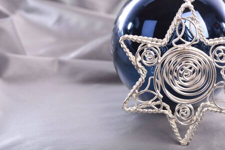 Christmas star decorations on silver backgroundの写真素材