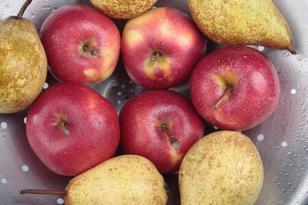 Ripe Red apples and pears fruit closeupの写真素材