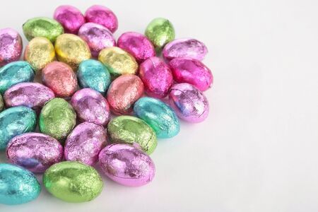 Colored easter eggs over white backgroud