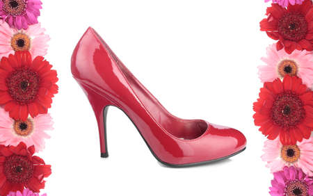 Sexy red heel shoe with flowers over whiteの写真素材