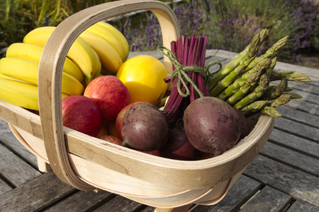 Vegetables and fruit mixed in basketの写真素材