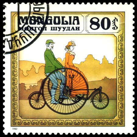 MONGOLIA - CIRCA 1982: A stamp  printed  in Mongolia shows  old-time  England bicycle  1870,  series  Historic  bicycle,  circa 1982 の写真素材